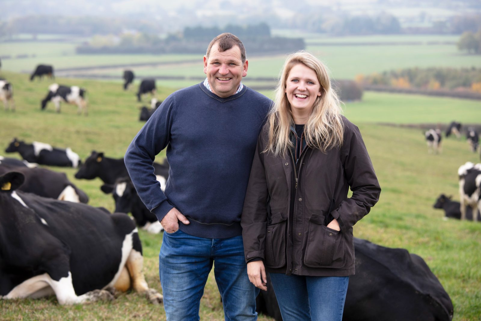 Clawson Farms farmers with the dairy herd