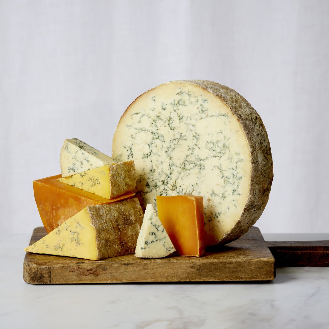 Long Clawson Blue Stilton wheel with coloured wedges